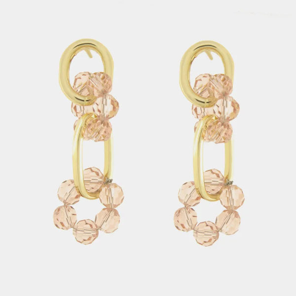 Orecchini in Metallo con cristalli rosa intrecciati — collezione serenissima